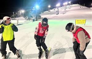  3 students on skis at Mt. Brighton slopes